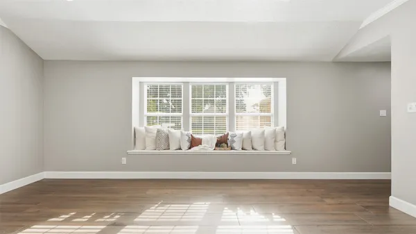 a view of a kitchen with a refrigerator and a stove top oven
