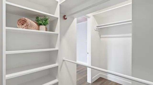 an aerial view of residential houses with outdoor space and river