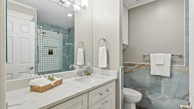 an aerial view of residential houses with outdoor space