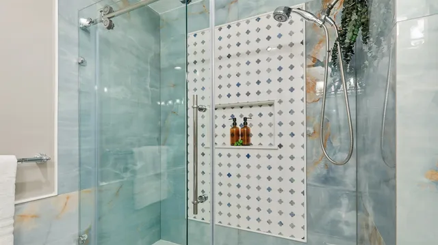 front view of a house with a yard and potted plants