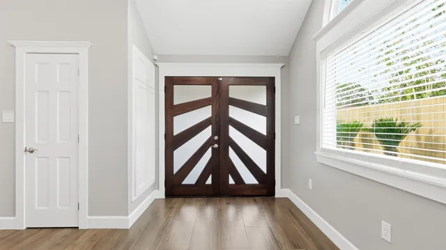 a bathroom with a sink vanity granite and a shower