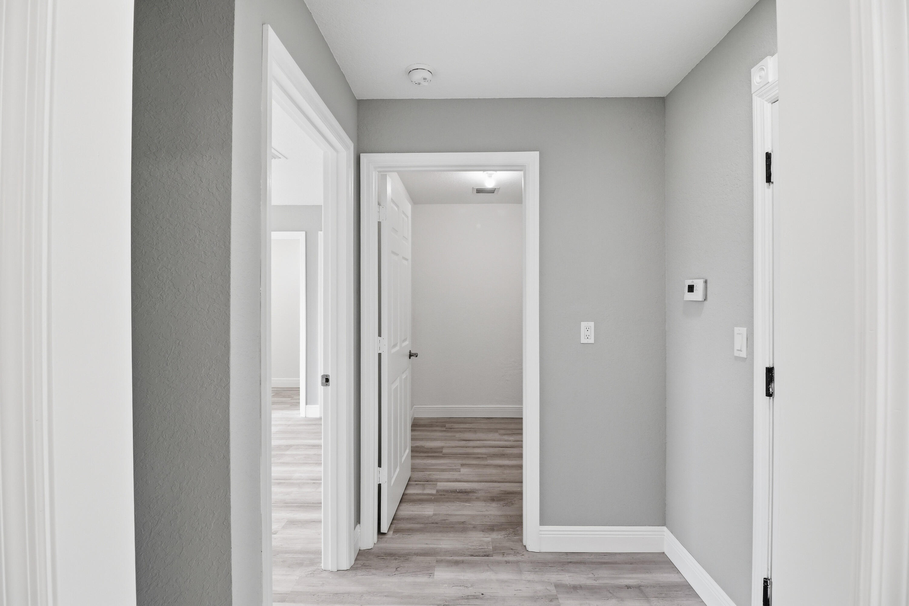 2805 Southeast Carroll Street Stuart, FL 34997 - Photo 8 of 21 a view of a hallway with wooden floor
