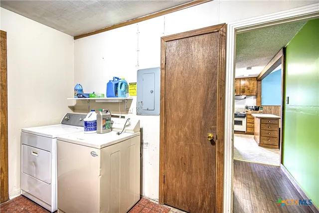 a storage room with washer and dryer