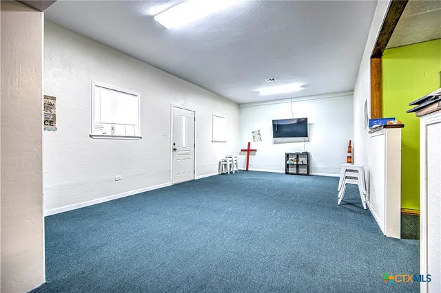 a view of livingroom with furniture and a flat screen tv