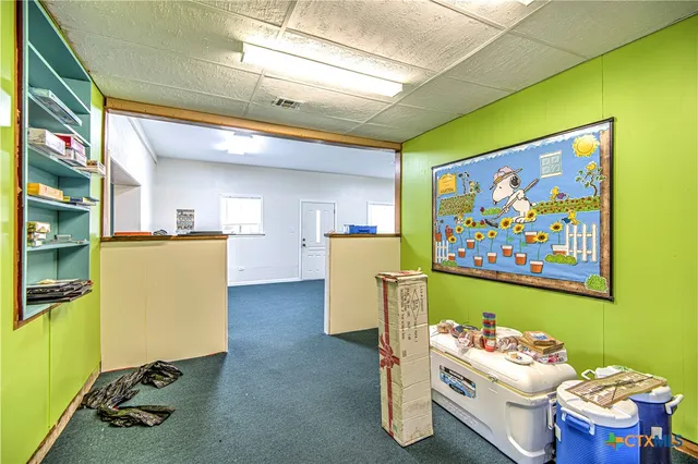 a room with furniture and screen gym equipment