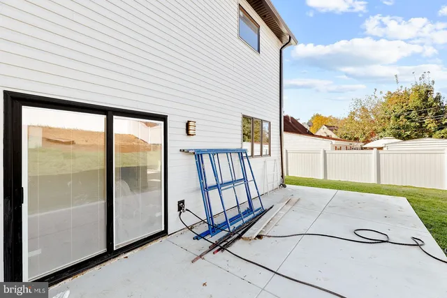 a view of a backyard with sitting area