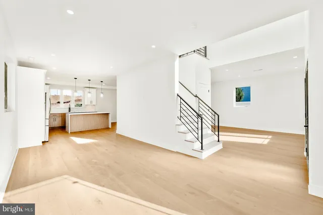 a view of a kitchen with a sink and cabinets