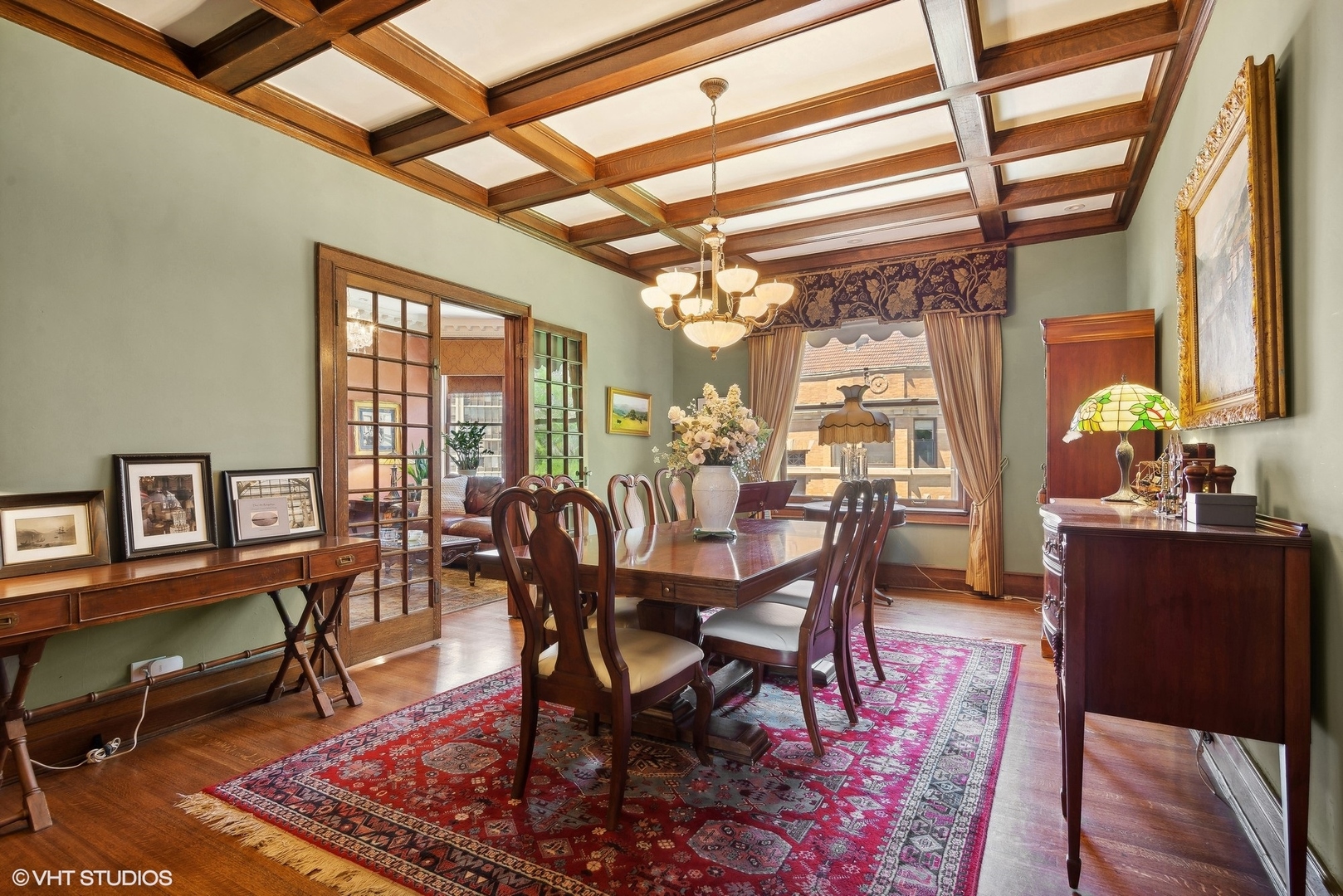 662 West Irving Park Road, Unit J4 Chicago, IL 60613 - Photo 12 of 31 a view of a dining room with furniture window and wooden floor