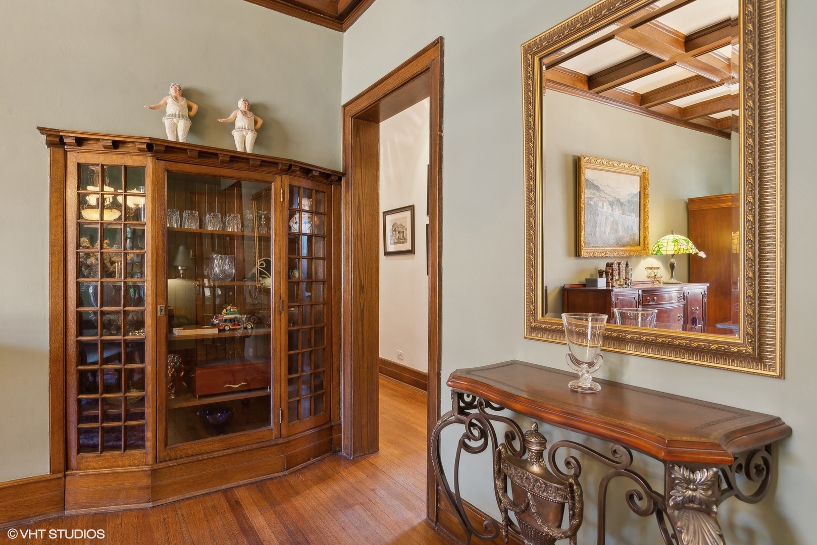 662 West Irving Park Road, Unit J4 Chicago, IL 60613 - Photo 13 of 31 a room with chandelier fan and wooden floor