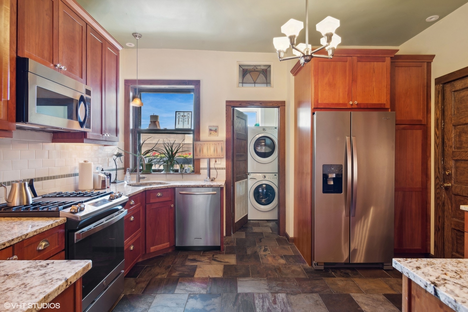662 West Irving Park Road, Unit J4 Chicago, IL 60613 - Photo 16 of 31 a kitchen with stainless steel appliances granite countertop a refrigerator a stove and a sink