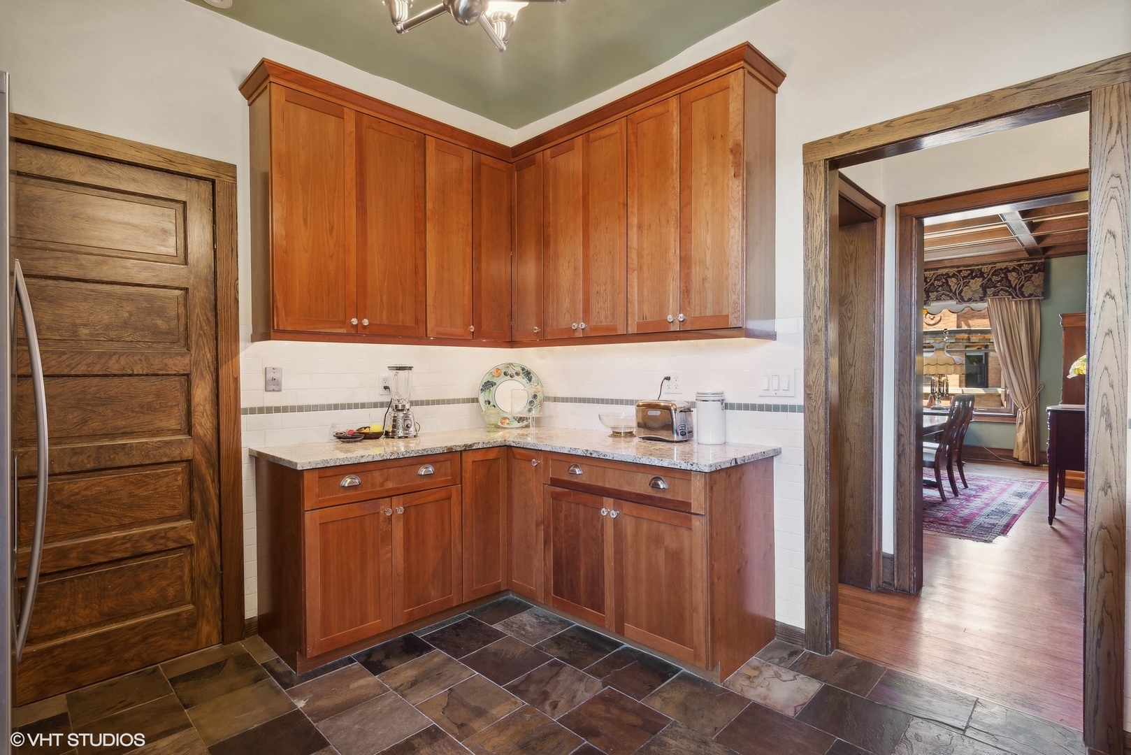662 West Irving Park Road, Unit J4 Chicago, IL 60613 - Photo 18 of 31 a kitchen with stainless steel appliances a sink and cabinets
