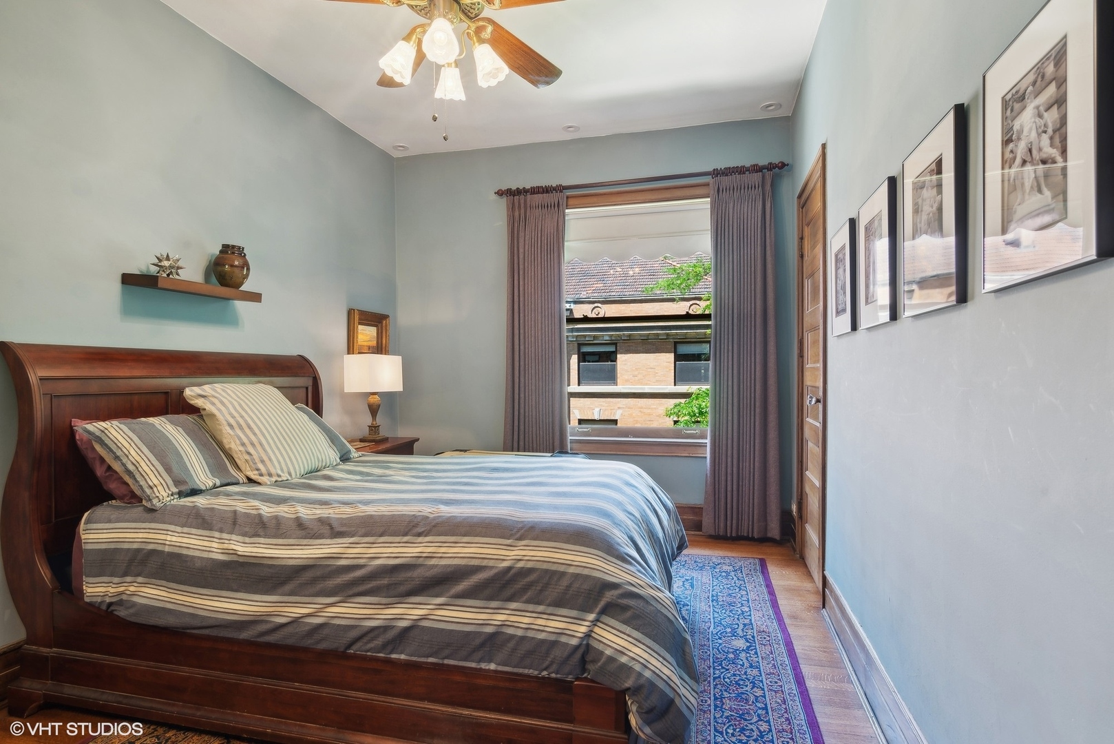 662 West Irving Park Road, Unit J4 Chicago, IL 60613 - Photo 21 of 31 a bedroom with a bed and a window