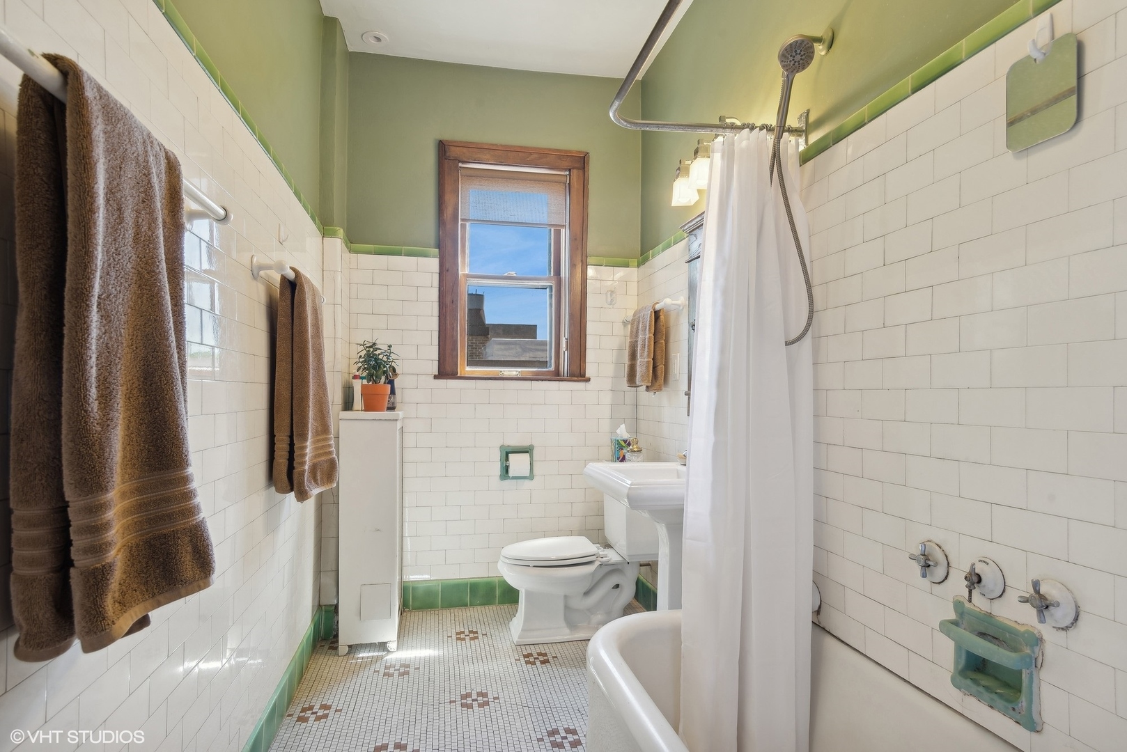 662 West Irving Park Road, Unit J4 Chicago, IL 60613 - Photo 22 of 31 a bathroom with a sink toilet and shower
