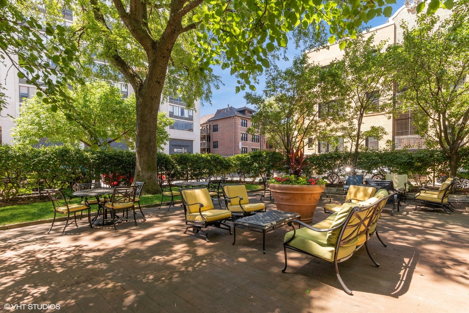 662 West Irving Park Road, Unit J4 Chicago, IL 60613 - Photo 29 of 31 a view of swimming pool with outdoor seating and trees