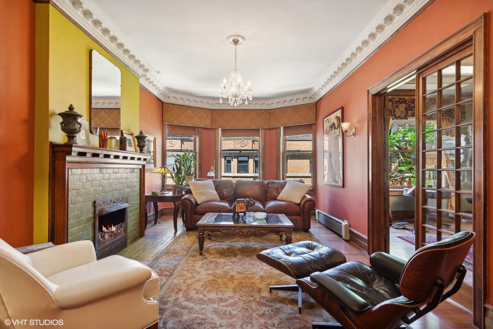 662 West Irving Park Road, Unit J4 Chicago, IL 60613 - Photo 5 of 31 a living room with furniture a fireplace and a large window