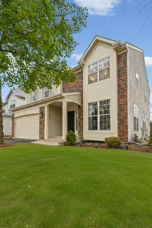 front view of a house with a yard