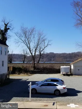 a view of house with car parked