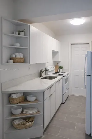 a kitchen with a sink and cabinets