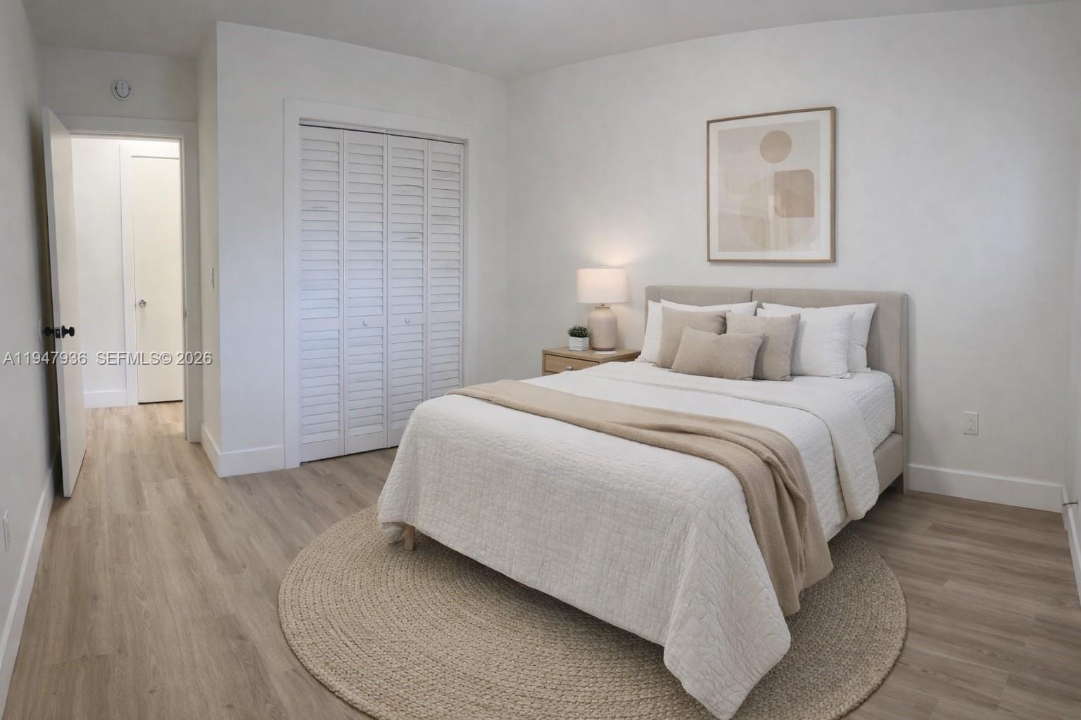 791 Southwest 64th Avenue, Unit 5 Miami, FL 33144 - Photo 4 of 9 a bedroom with a bed and a walk in closet