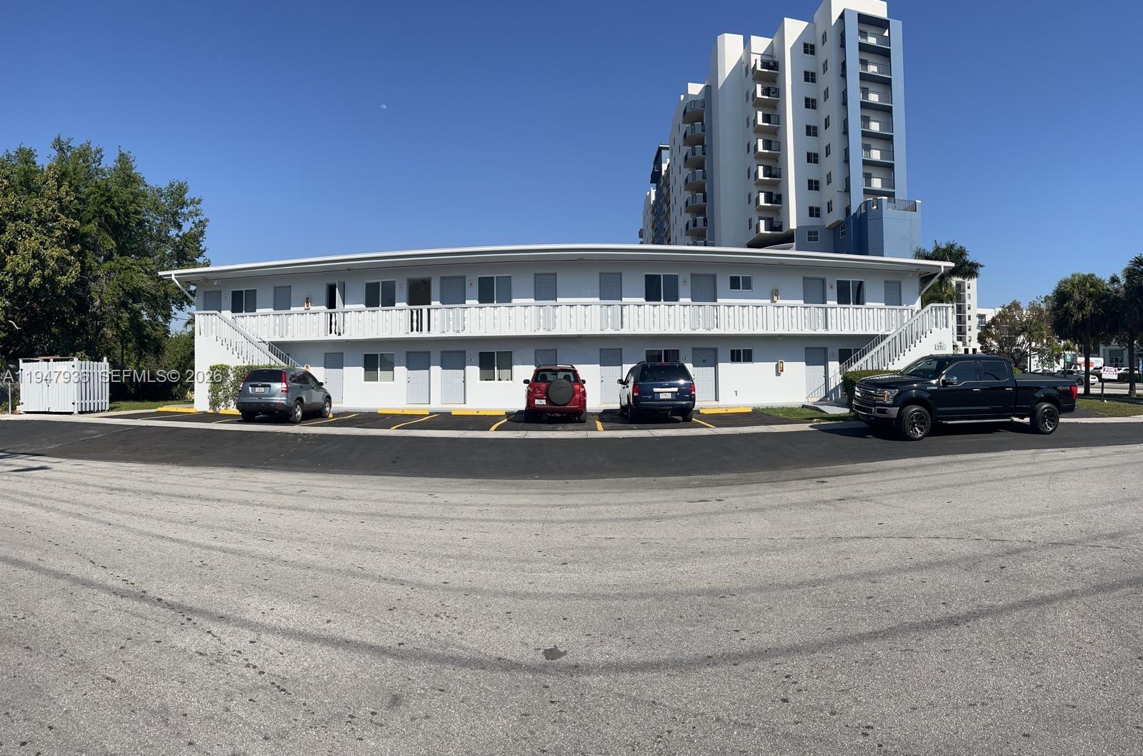 791 Southwest 64th Avenue, Unit 5 Miami, FL 33144 - Photo 9 of 9 a view of building with car parked