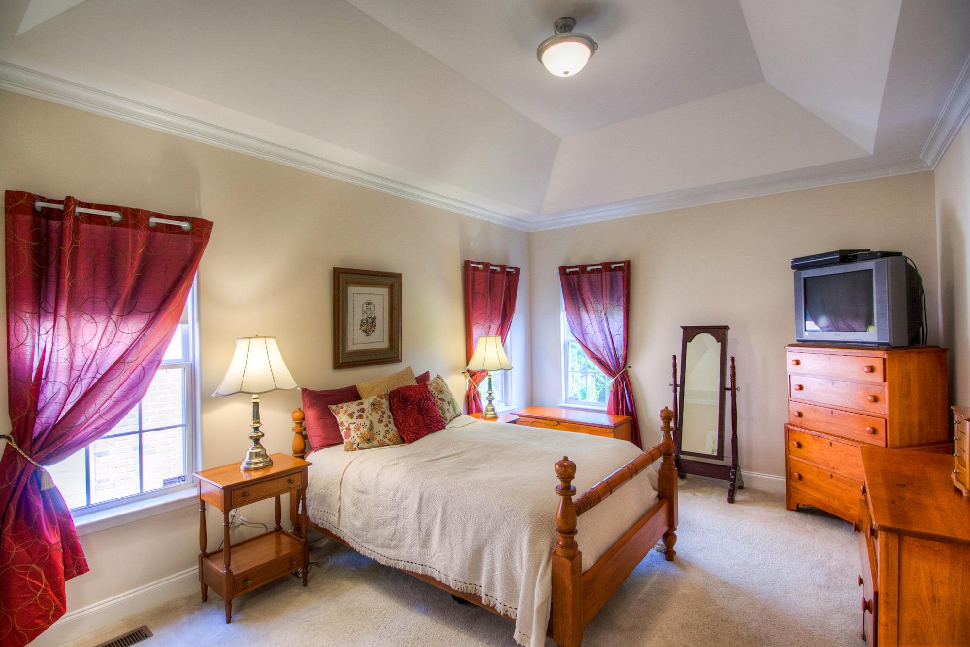7084 Red Apple Road Antioch, TN 37013 - Photo 16 of 30 a bedroom with a bed and wooden floor