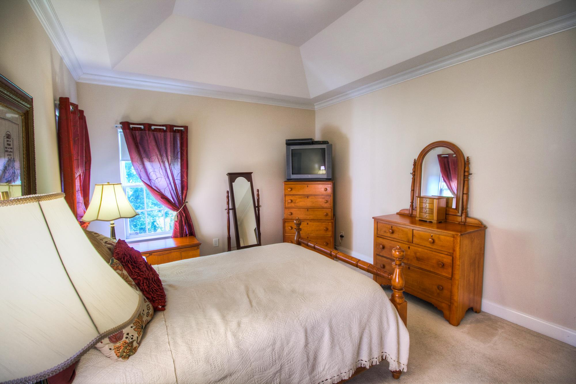 7084 Red Apple Road Antioch, TN 37013 - Photo 18 of 30 a bedroom with a bed next to a window