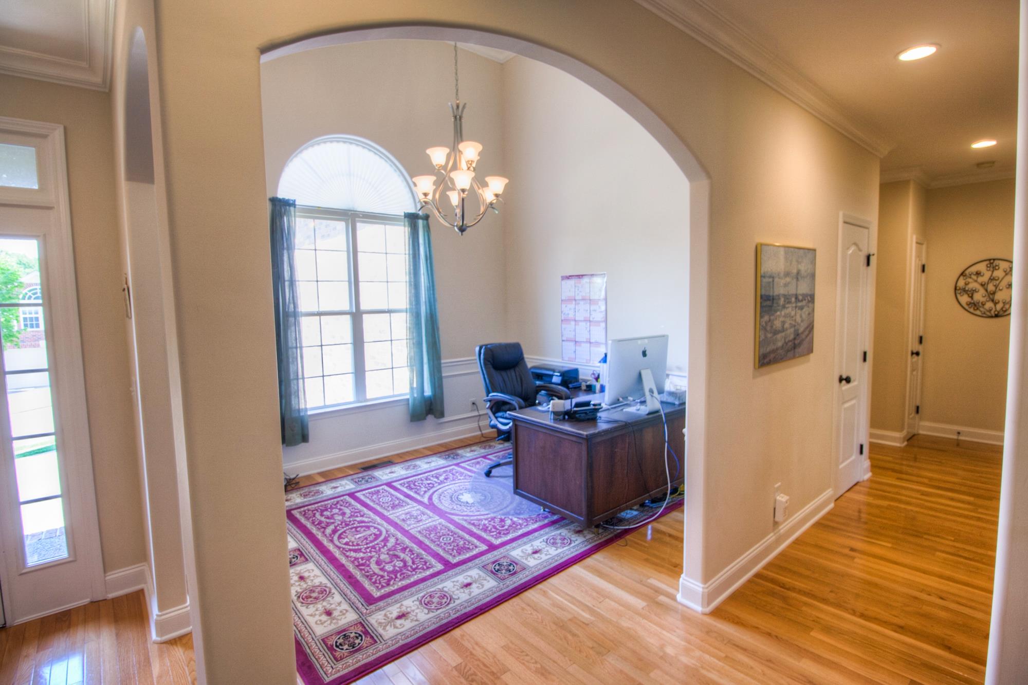 7084 Red Apple Road Antioch, TN 37013 - Photo 3 of 30 a living room with furniture chandelier and wooden floor