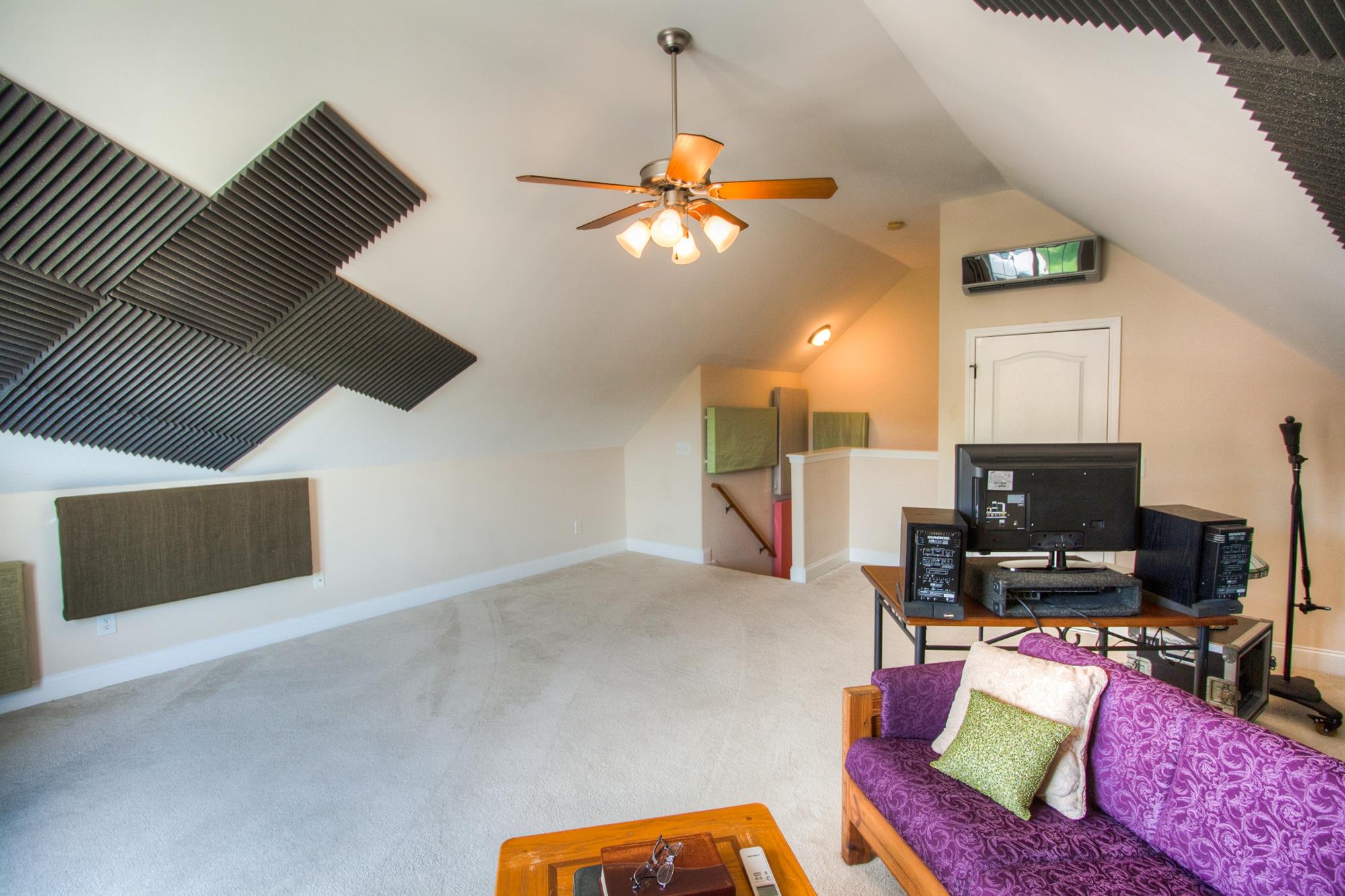 7084 Red Apple Road Antioch, TN 37013 - Photo 27 of 30 a living room with furniture and a flat screen tv