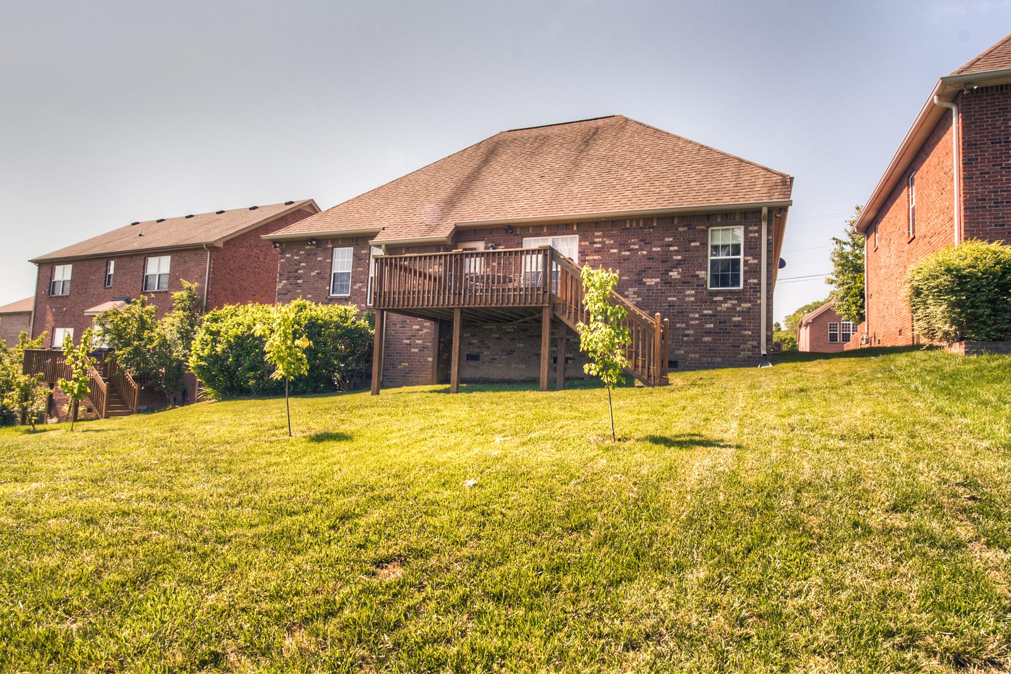 7084 Red Apple Road Antioch, TN 37013 - Photo 28 of 30 a view of a house with a yard and a garage
