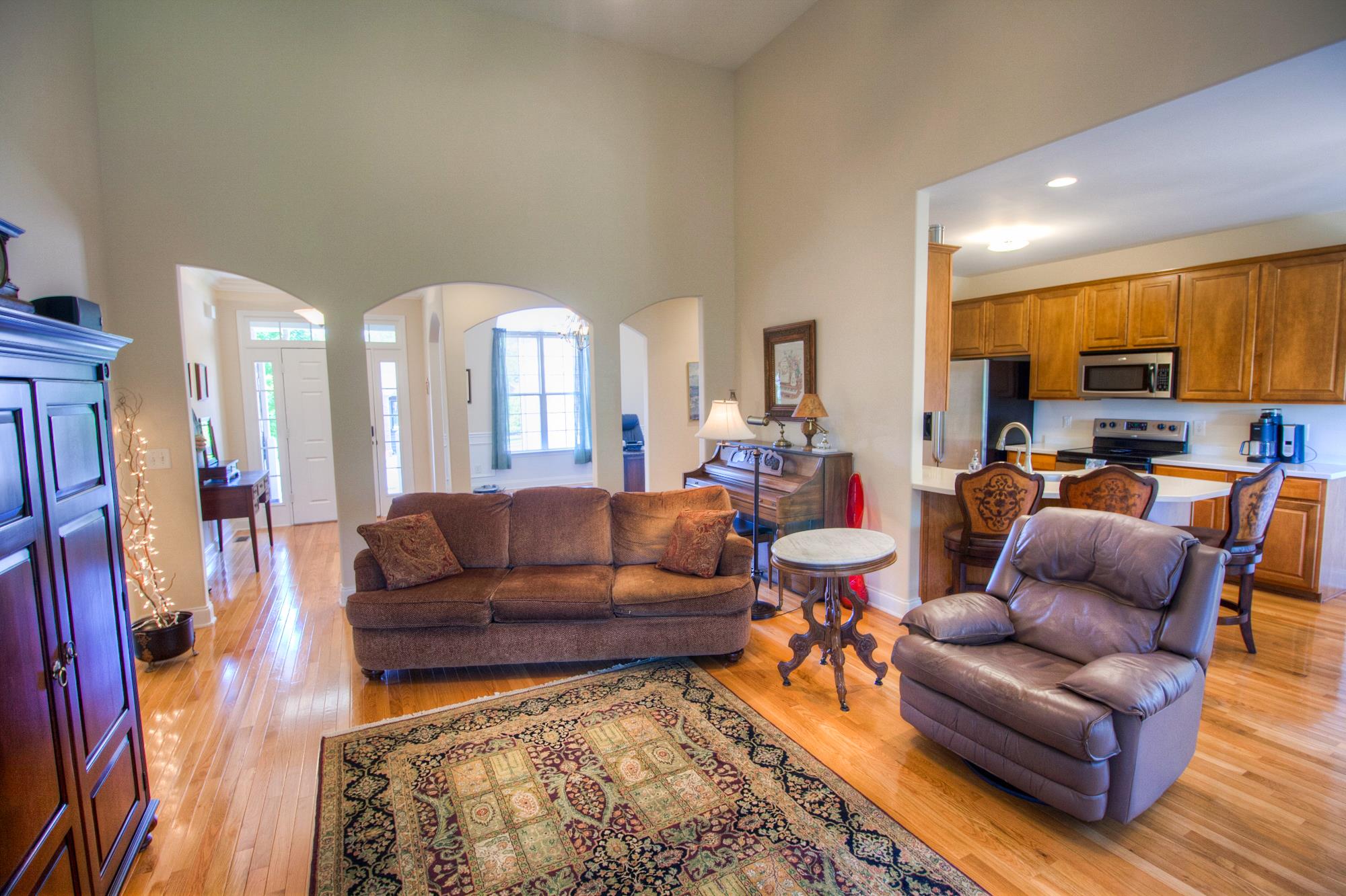7084 Red Apple Road Antioch, TN 37013 - Photo 6 of 30 a living room with furniture a rug and a view of kitchen