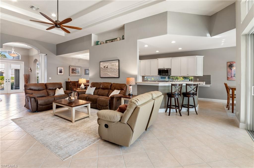 19896 Casa Verde Way Estero, FL 33967 - Photo 12 of 48 a living room with lots of furniture and a large window