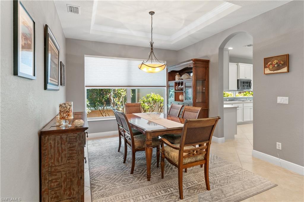 19896 Casa Verde Way Estero, FL 33967 - Photo 13 of 48 a dining room with furniture and window