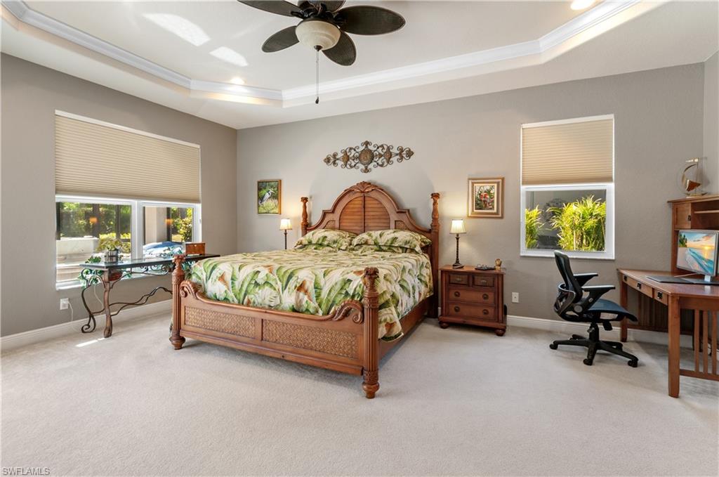 19896 Casa Verde Way Estero, FL 33967 - Photo 18 of 48 a bedroom with a bed gym equipment and a large window