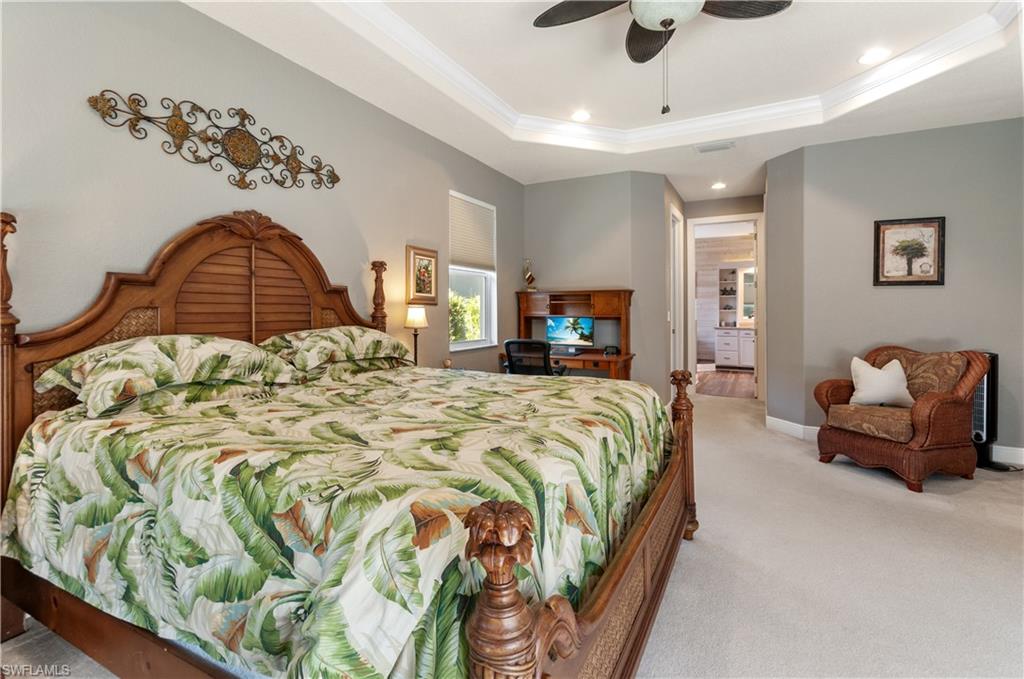 19896 Casa Verde Way Estero, FL 33967 - Photo 20 of 48 a spacious bedroom with a bed and couch