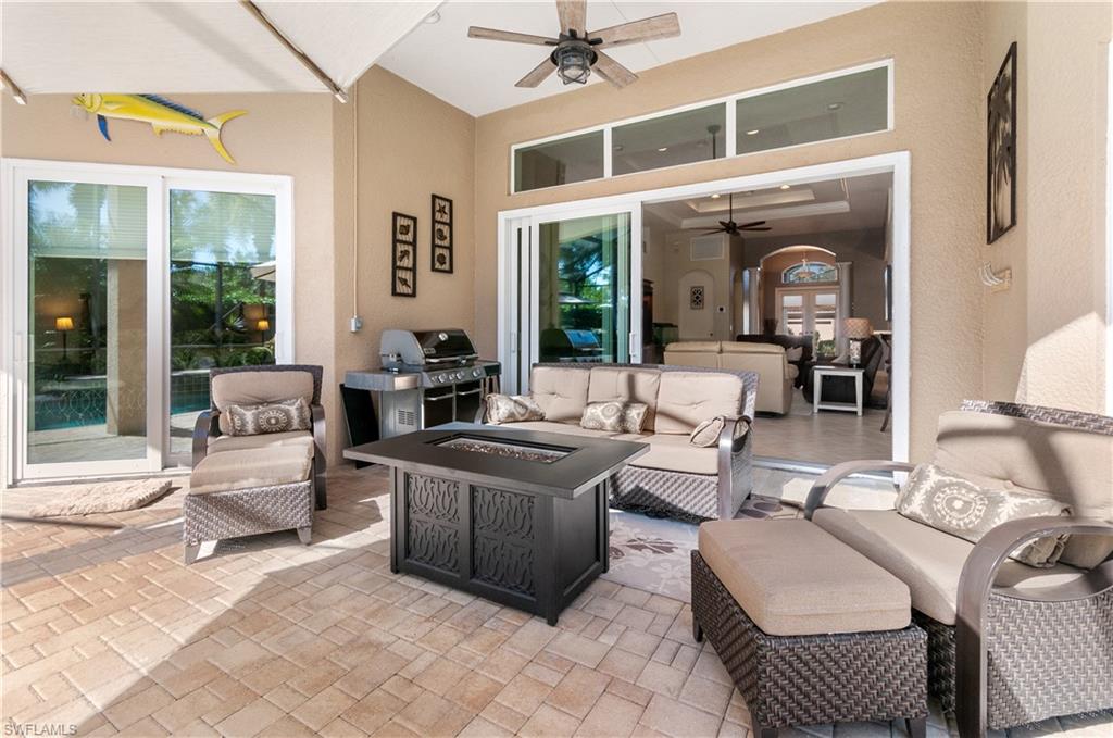 19896 Casa Verde Way Estero, FL 33967 - Photo 32 of 48 a living room with furniture and a large window