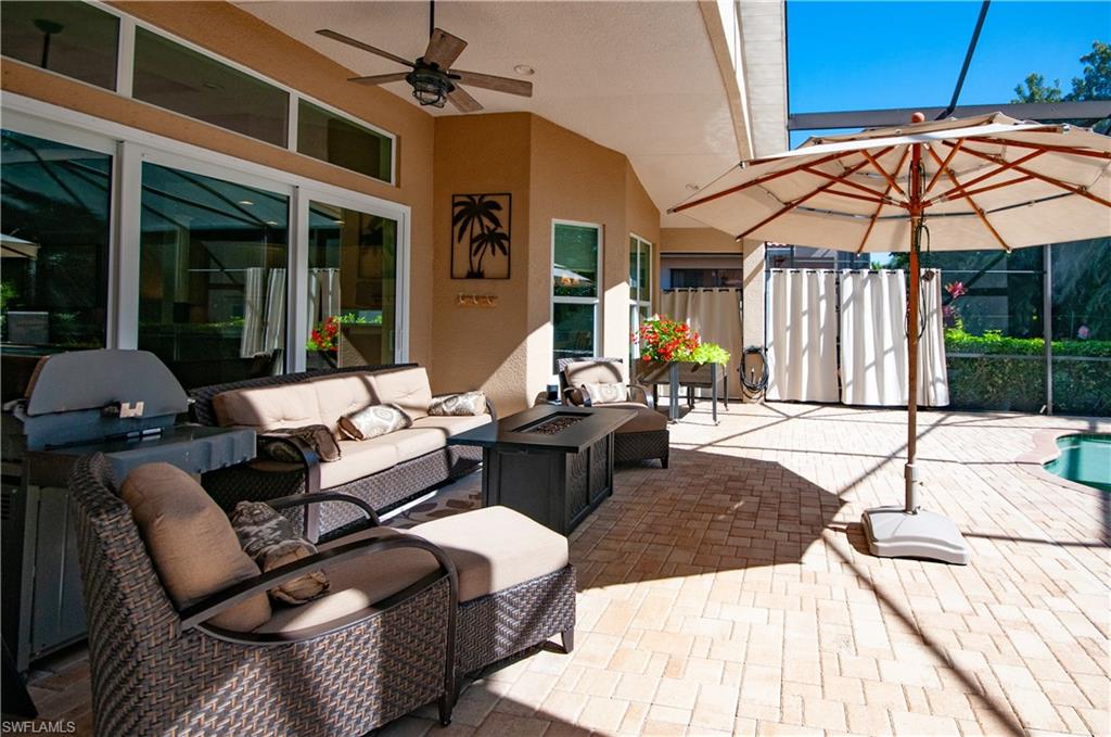19896 Casa Verde Way Estero, FL 33967 - Photo 33 of 48 a outdoor space with patio the couches and flat tv