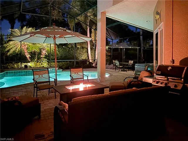 a view of a house with backyard porch and furniture