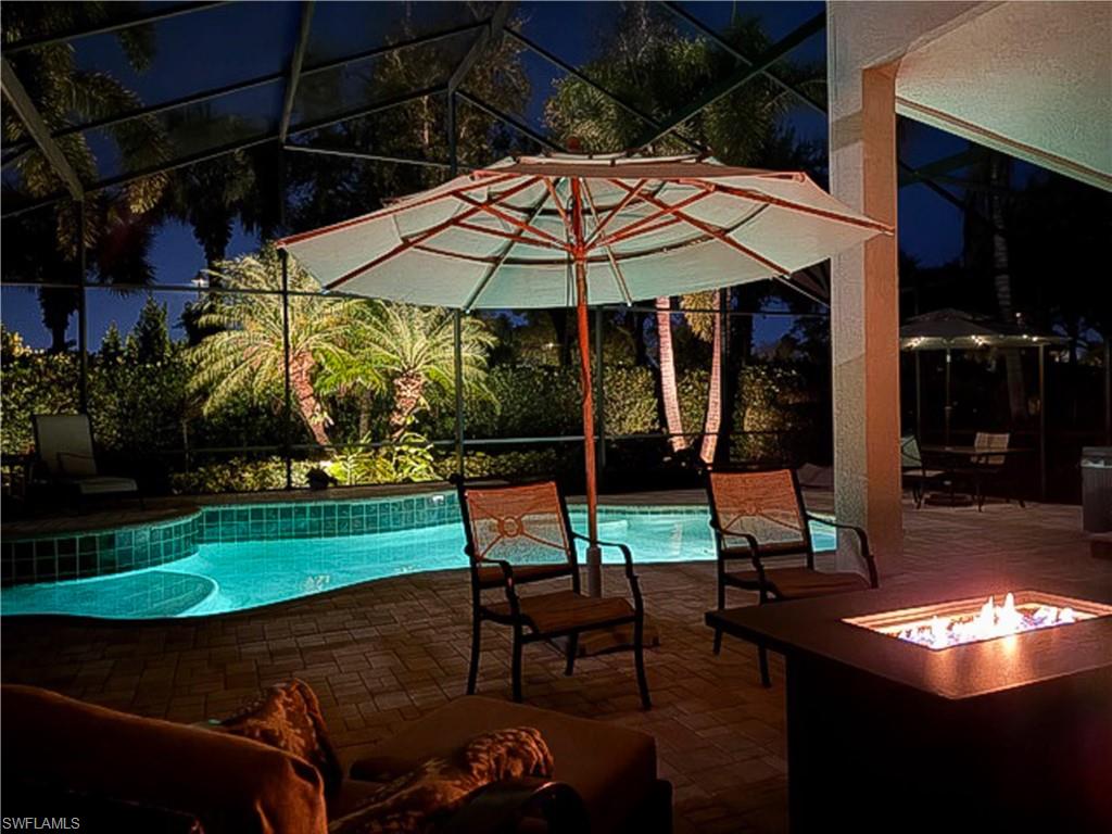 19896 Casa Verde Way Estero, FL 33967 - Photo 38 of 48 a view of a chairs and table in backyard