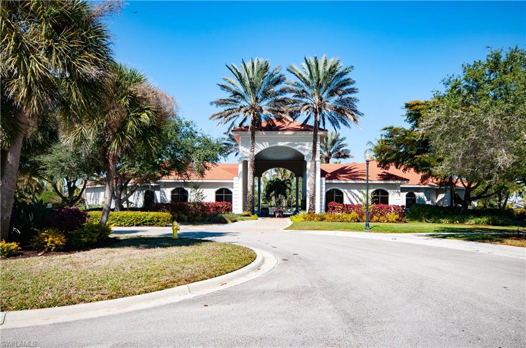 19896 Casa Verde Way Estero, FL 33967 - Photo 41 of 48 a front view of a house with a garden and plants