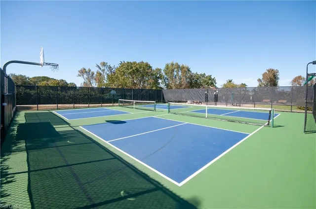 a view of an outdoor space and tennis court