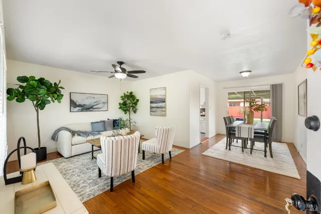a living room with furniture and a table