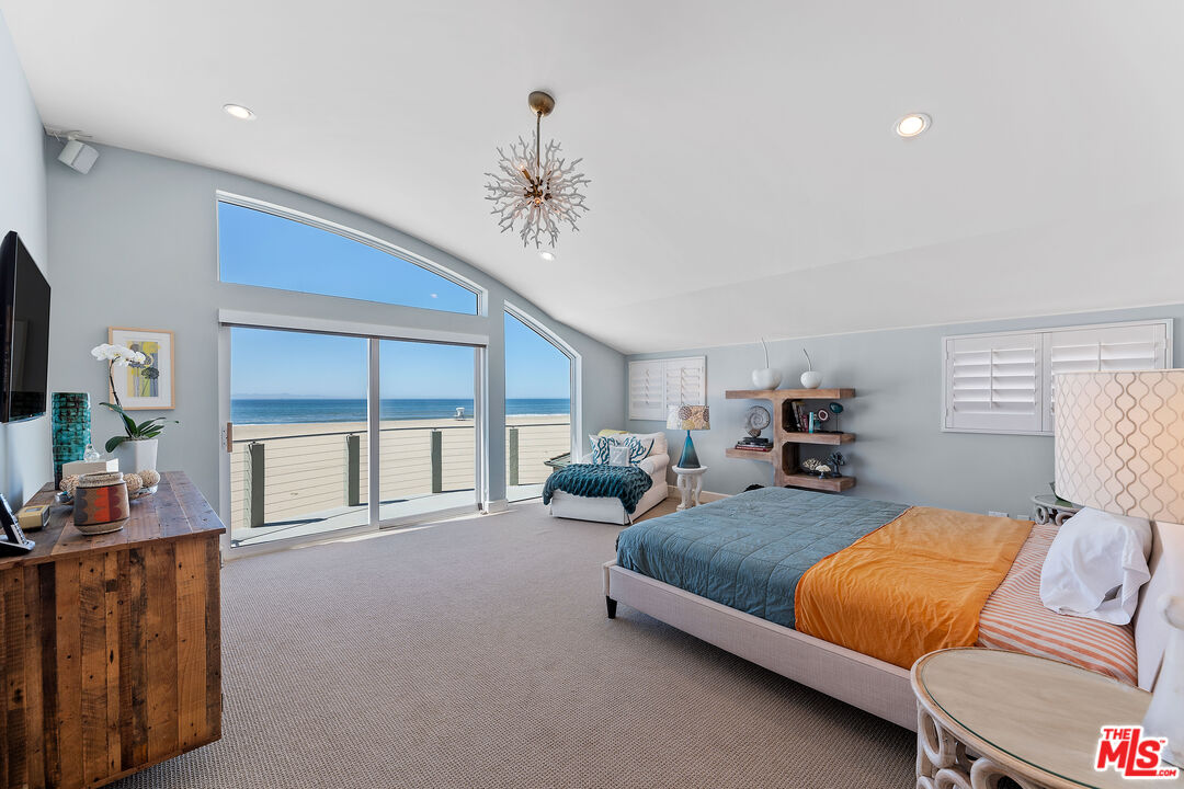 3741 Ocean Drive Oxnard, CA 93035 - Photo 12 of 29 a bedroom with furniture and a large window