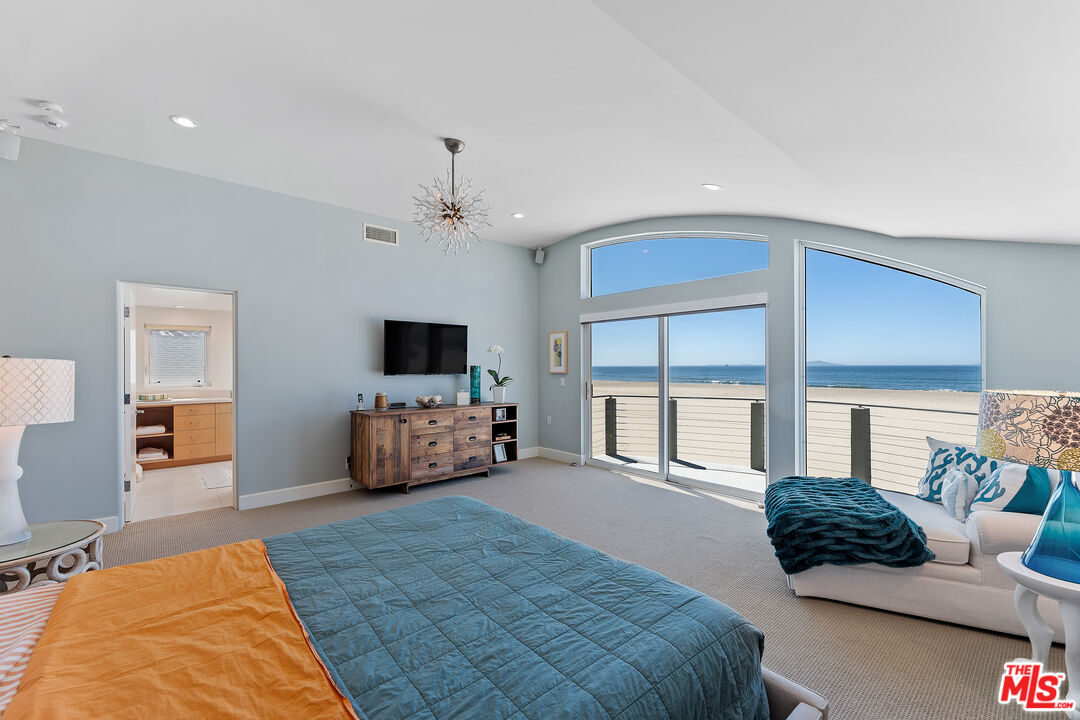 3741 Ocean Drive Oxnard, CA 93035 - Photo 14 of 29 a bedroom with furniture and a flat screen tv