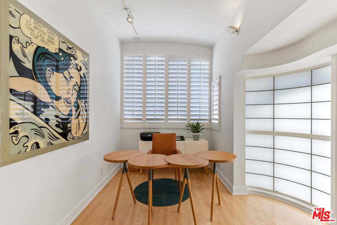 3741 Ocean Drive Oxnard, CA 93035 - Photo 17 of 29 a view of a dining room with furniture and wooden floor