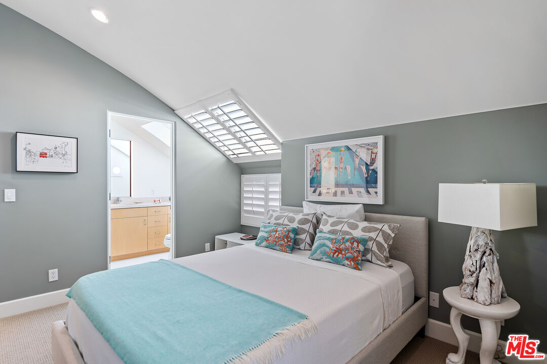 3741 Ocean Drive Oxnard, CA 93035 - Photo 19 of 29 a bedroom with a bed and a lamp on table