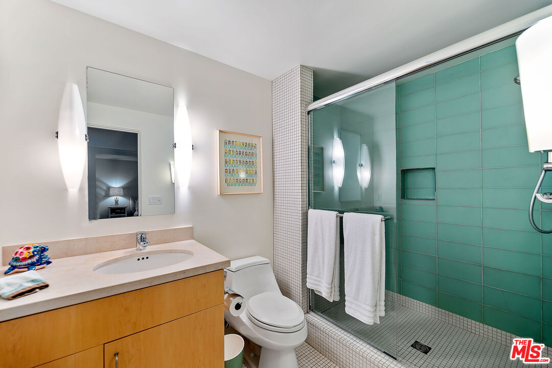 3741 Ocean Drive Oxnard, CA 93035 - Photo 26 of 29 a bathroom with a sink toilet and shower