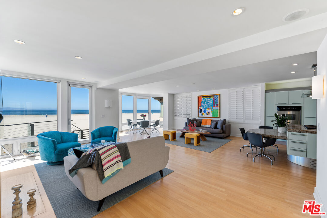 3741 Ocean Drive Oxnard, CA 93035 - Photo 5 of 29 a living room with furniture and a fireplace