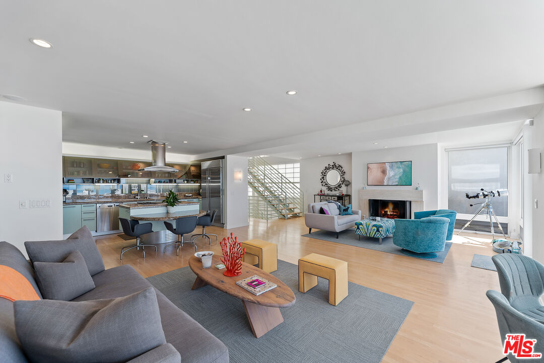 3741 Ocean Drive Oxnard, CA 93035 - Photo 8 of 29 a living room with furniture and a wooden floor