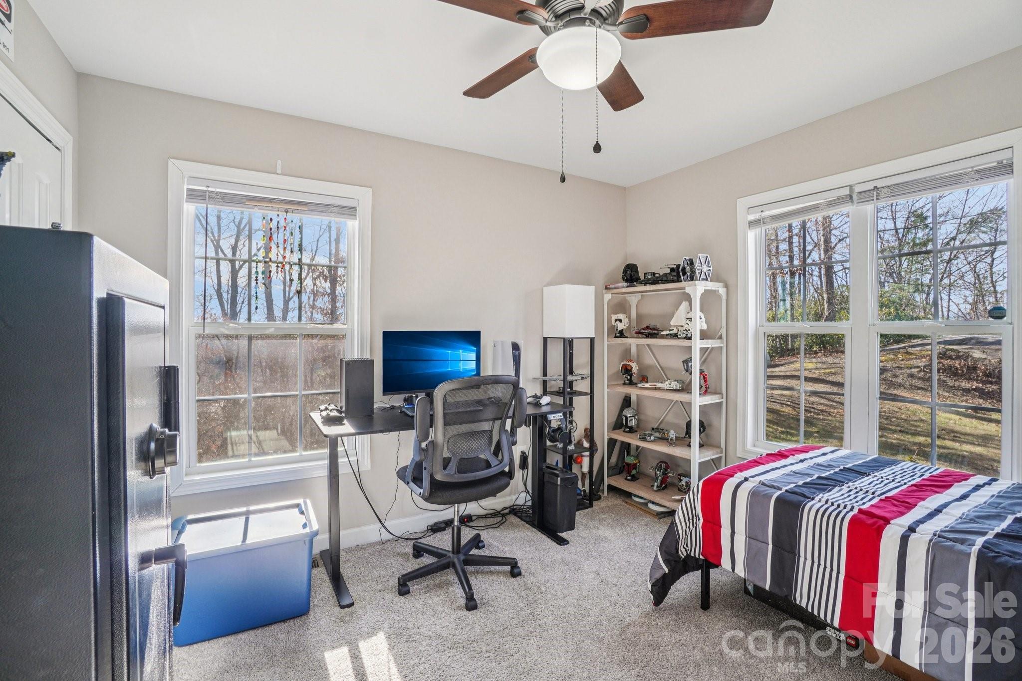 178 Rowe Court Hendersonville, NC 28792 - Photo 13 of 21 a bedroom with bed and a chandelier