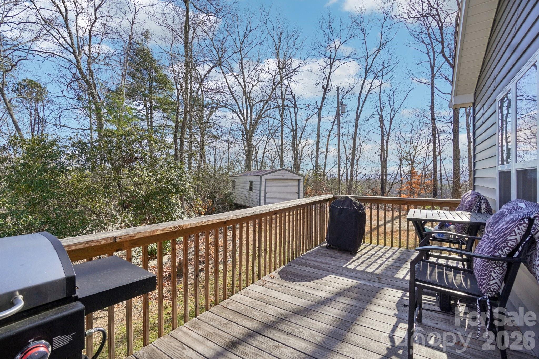 178 Rowe Court Hendersonville, NC 28792 - Photo 17 of 21 a view of balcony with wooden floor and outdoor seating